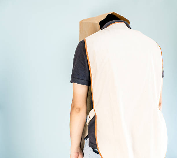 istock Depressed caregiver putting paper bag on 599680638