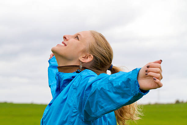 istock Happy woman with raised arms 599683440