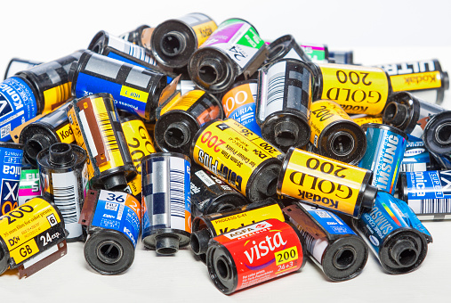 Minsk, Belarus-May 30, 2015: Bulk Variety of Old Photo Films Cassettes of Different World Leading Manufacturers Placed in Heap Together against White Background shot in Studio on May 30, 2015 in Minsk, Republic of Belarus
