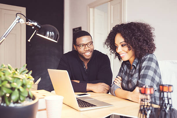 istock Two designers in the office, using laptop together 599687930