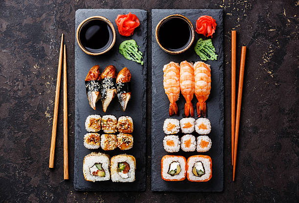 sushi rolls, maki, nigiri served for two - susi imagens e fotografias de stock