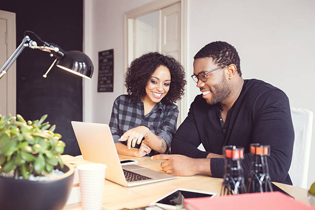 istock Two designers in the office, using laptop together 599688208
