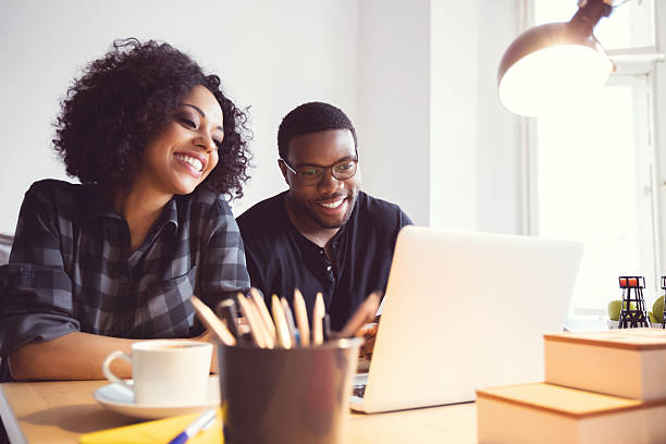 istock Two designers in the office, using laptop together 599688442