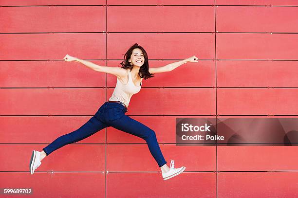 Jumping Happy Girl Stock Photo - Download Image Now - Happiness, Women, On The Move