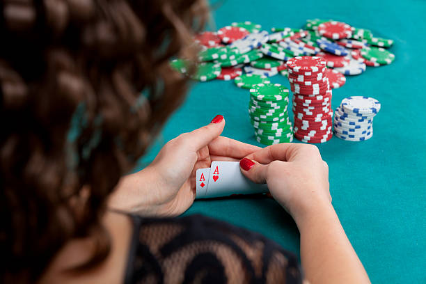 istock Young woman with poker cards 599693774