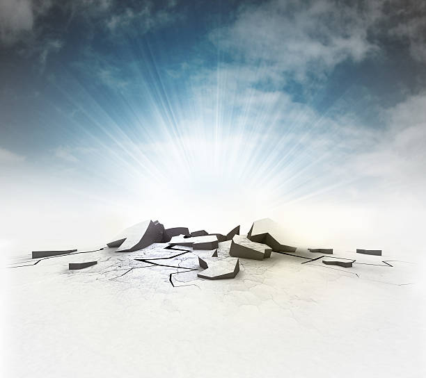 istock cracked ground hole with flare and sky 599694322