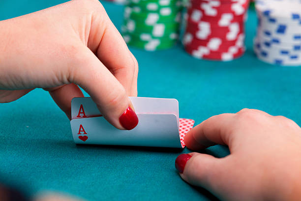 istock Young woman with poker cards 599694340