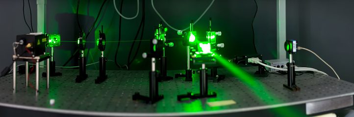 green lasers in the laboratory, laser beams among the optical elements, the study of light and cognitive phenomena