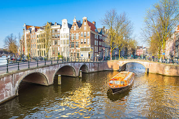 istock Beautiful view of Amsterdam canals with bridge and typical dutch 599695104