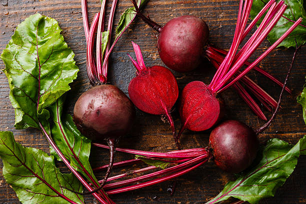 red beetroot with green leaves - beet common beet red food imagens e fotografias de stock