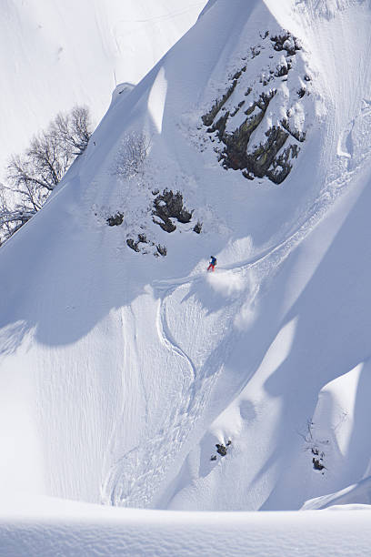 istock Snowboard freeride, snowboarders and tracks on a mountain slope. Extreme 599695732