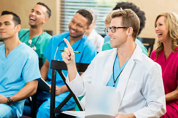 istock Young Caucasian doctor makes a point during a medical seminar 599696074