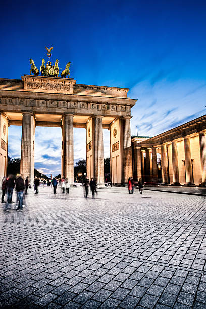 Berlin - Brandenburg Gate at night Local Berlin landmarks at night during a beautiful spring day. city gate stock pictures, royalty-free photos & images