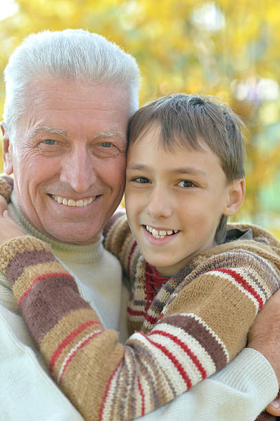 istock Grandfather and grandson in park 599696574