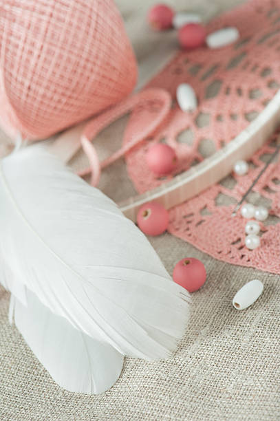istock White feathers, pearls, pink beads 599696864