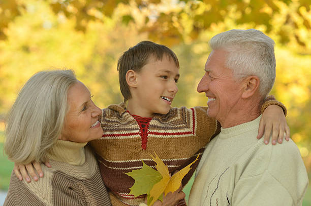 istock Family in autumn park 599697212