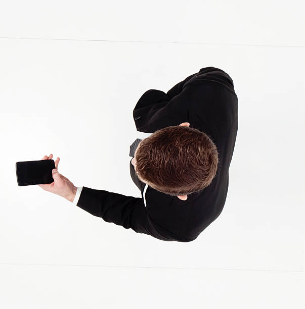 istock Above view of businessman using phone 599702528