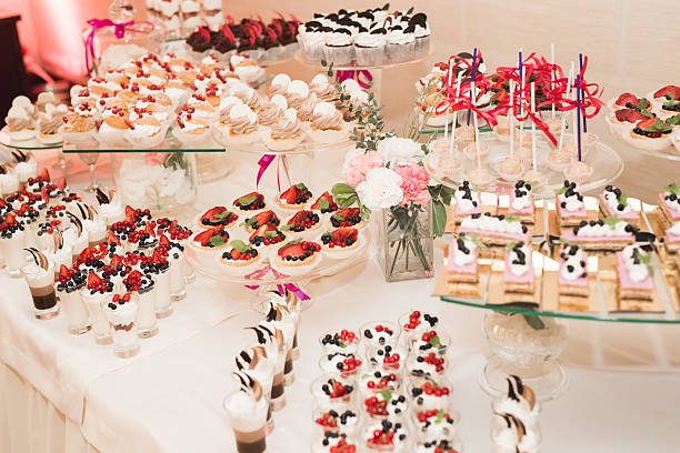 istock Delicious and tasty dessert table with cupcakes shots at reception 599702992