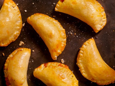 Homemade Calzones with Marinara Sauce  - Photographed on a Hasselblad H3D11-39 megapixel Camera System