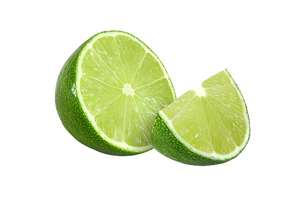 istock cut lime fruits isolated on white background with clipping path 599704410