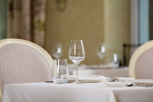 istock Empty glasses and plates installed in the restauran 599704994