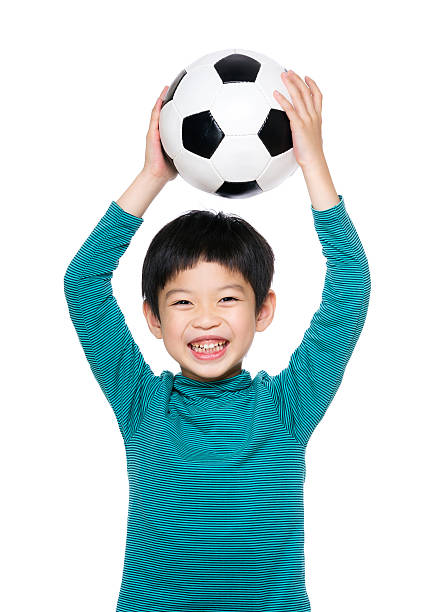 istock Chinese boy with a football 599705052