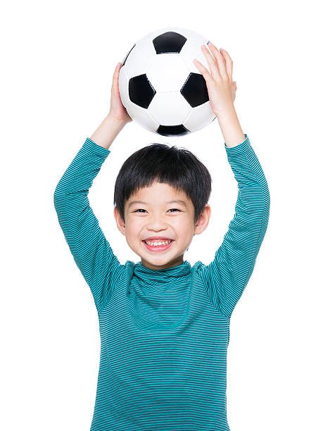 istock Chinese boy with a football 599705098