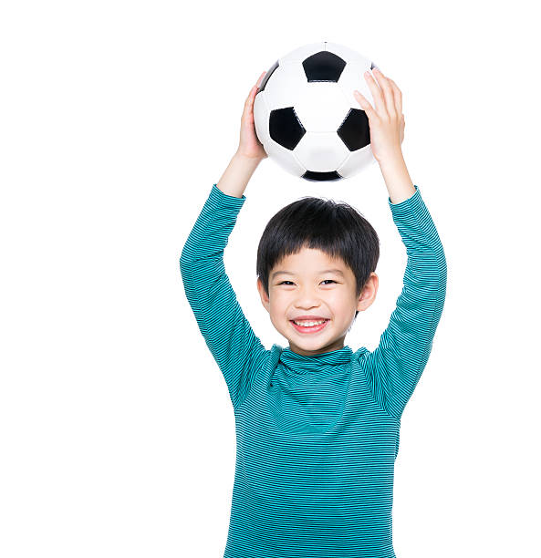 istock Chinese boy with a football 599705144