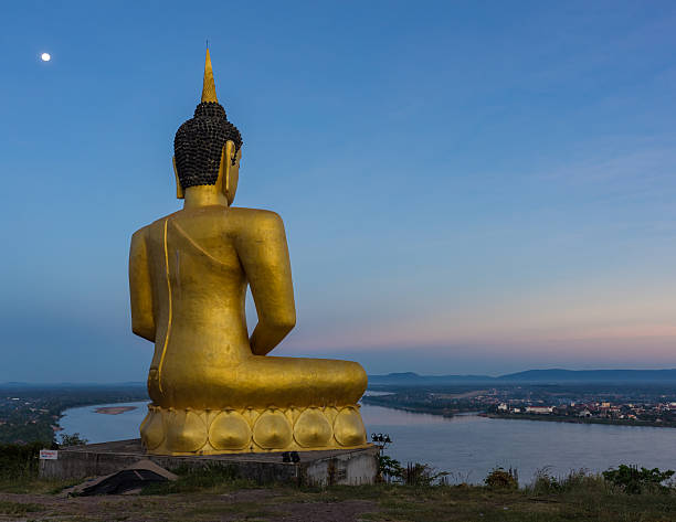 istock Buddha in blaze over the city at dawn 599705322