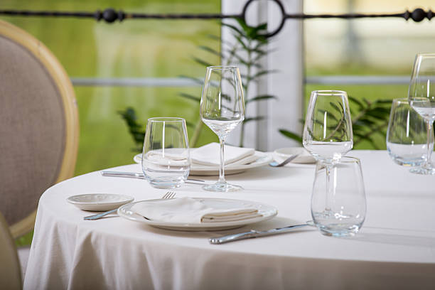 istock Empty glasses and plates installed in the restauran 599705490