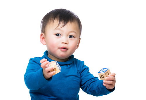 Portrait of Chinese toddler with building blocks