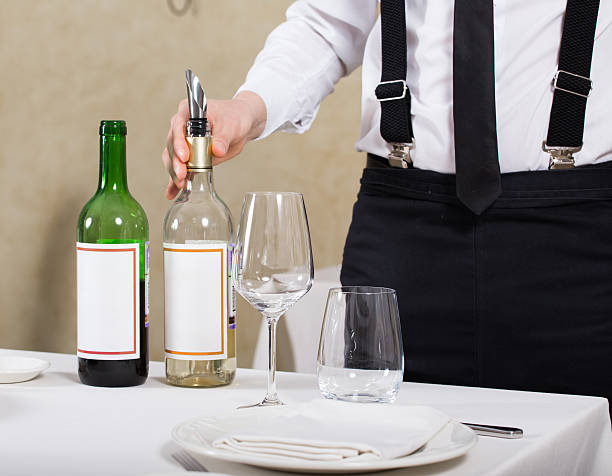 istock served table restaurant wine being poured into glass 599705828