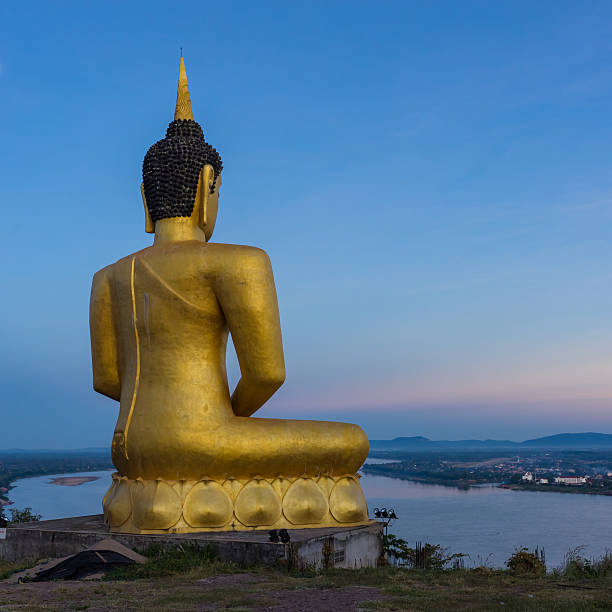 istock Buddha in blaze over the city at dawn 599706768