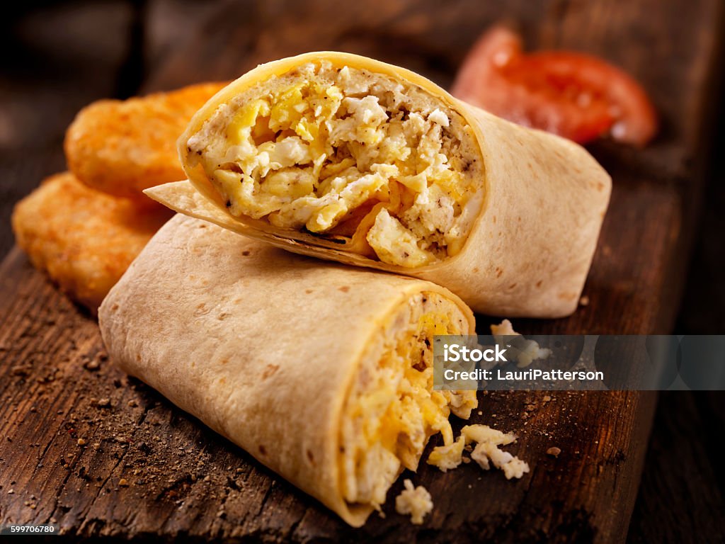 Scrambled Egg and Cheese Breakfast Wrap Scrambled Egg and Cheese Breakfast Wrap -Photographed on Hasselblad H3D2-39mb Camera Burrito Stock Photo