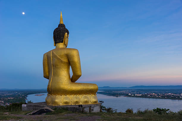 istock Buddha in blaze over the city at dawn 599707252