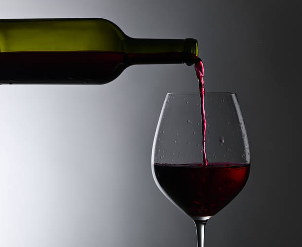 istock bottle and glass of red wine 599707634