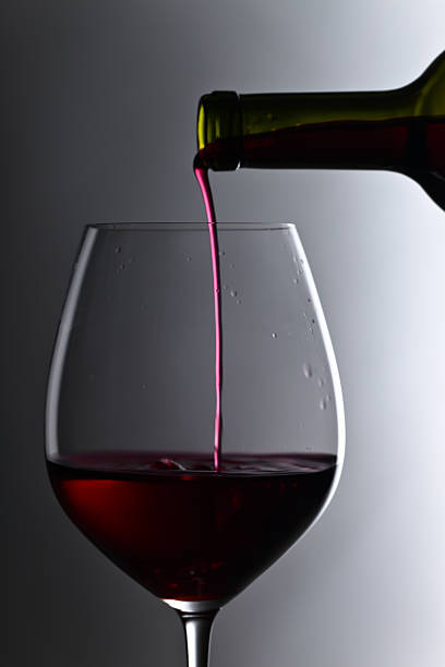istock bottle and glass of red wine 599707862