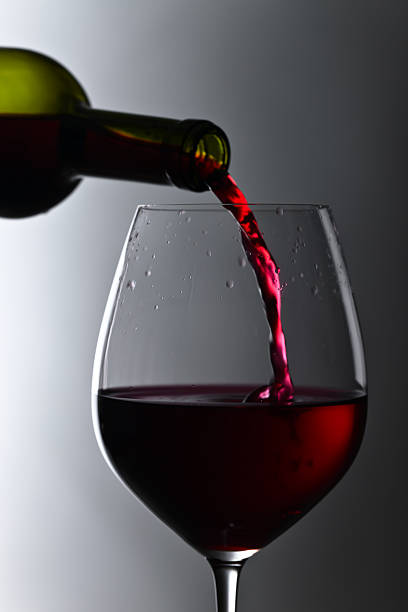 istock bottle and glass of red wine 599707930