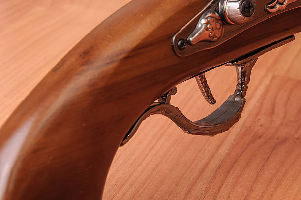 istock Vintage pistols on wooden background 599709116