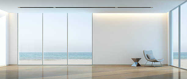 modern beach house interior, relaxing sea view living room - looking at view water sea blue imagens e fotografias de stock