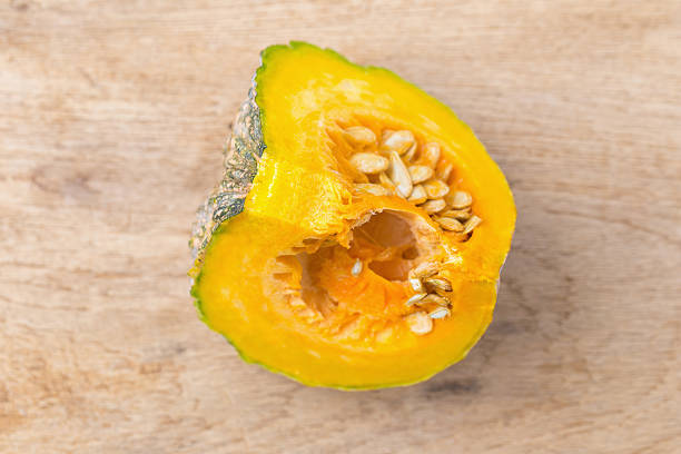 istock Slice of pumpkin on a wooden table 599710182