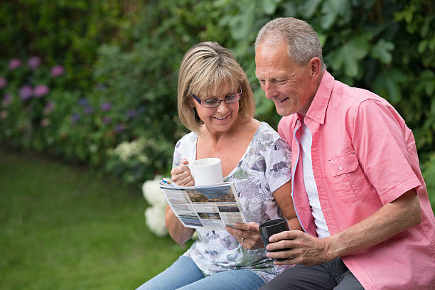 istock Senior couple reading the newspaper 599710244