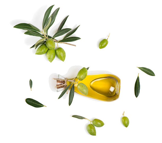 istock Olives with leaves and olive oil, above view. 599711296