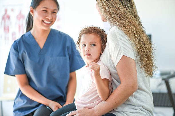 istock Mother Speaking with a Nurse 599711634