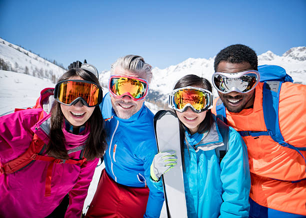 istock Happy group of friends skiing 599712128