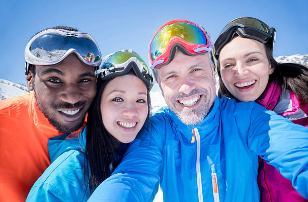 istock Group of friends skiing and taking a selfie 599712130