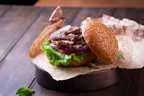 istock Delicious beef burger with salad ingredients 599712800