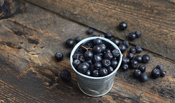 istock Ripe blueberries in a cup on rustic wooden table 599713628