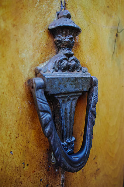 istock Old ancient door knocker on wooden door 599716872