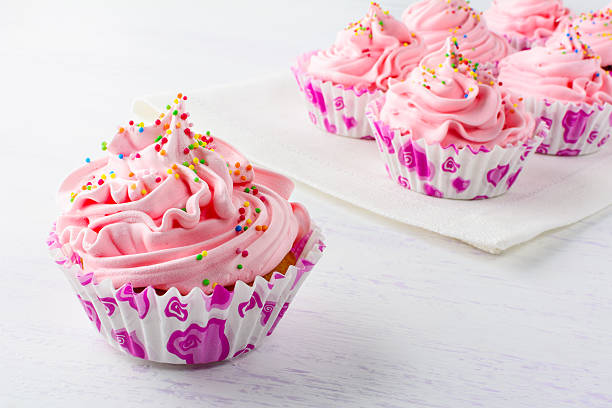 istock Pink birthday cupcakes close up 599717144